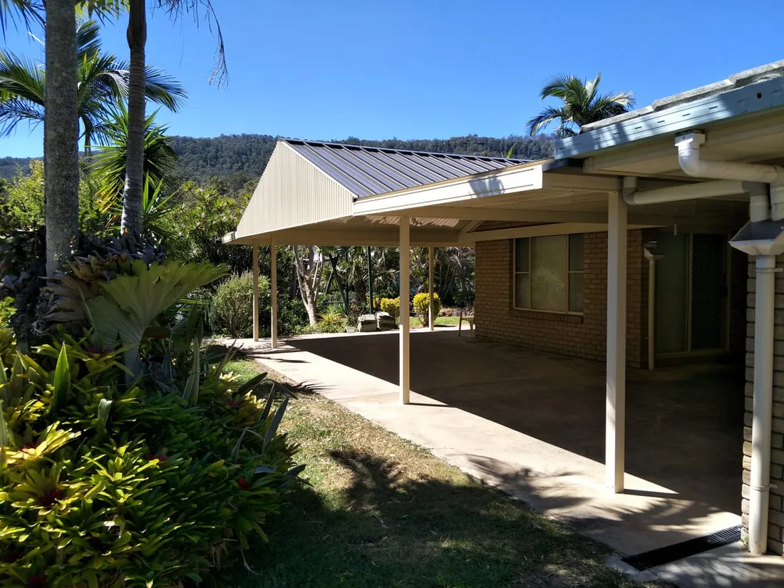 Gable patio and covered walkway alongside a brick Queensland home